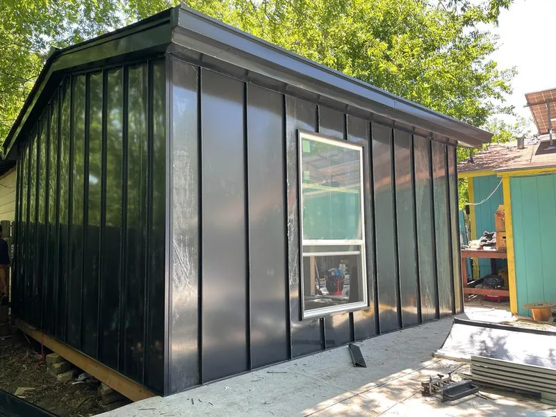 Black standing seam metal wall panels for Roof Inspection in Stayton