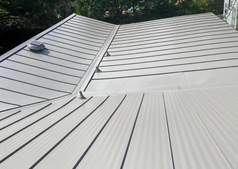 Solar attic fan installed on a metal roof for Roof Ventilation in Stayton
